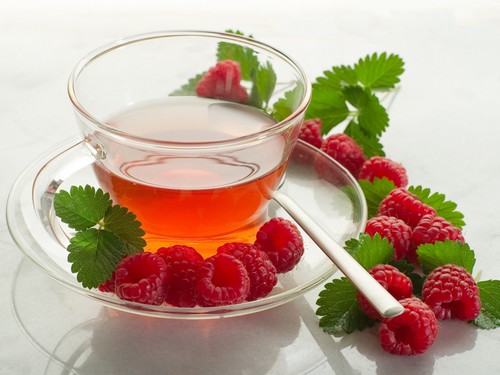 Hot tea with raspberries and honey 