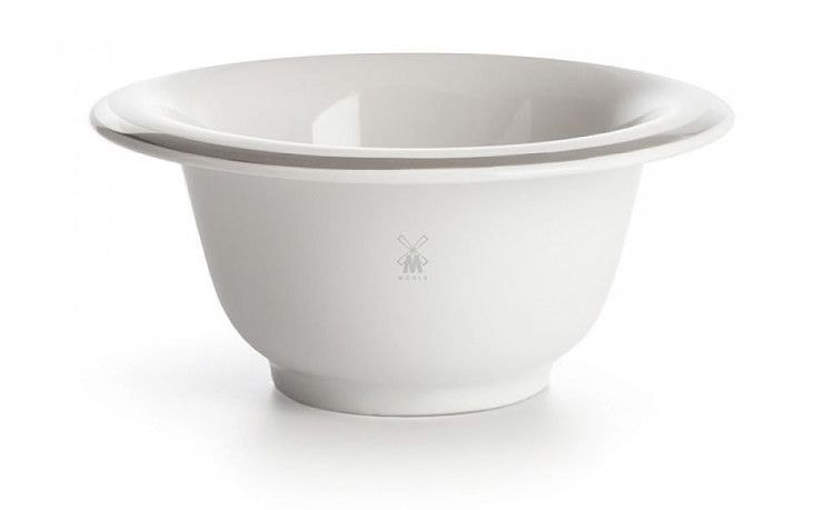 An example of a shaving bowl in the form of a small bowl made of white porcelain 