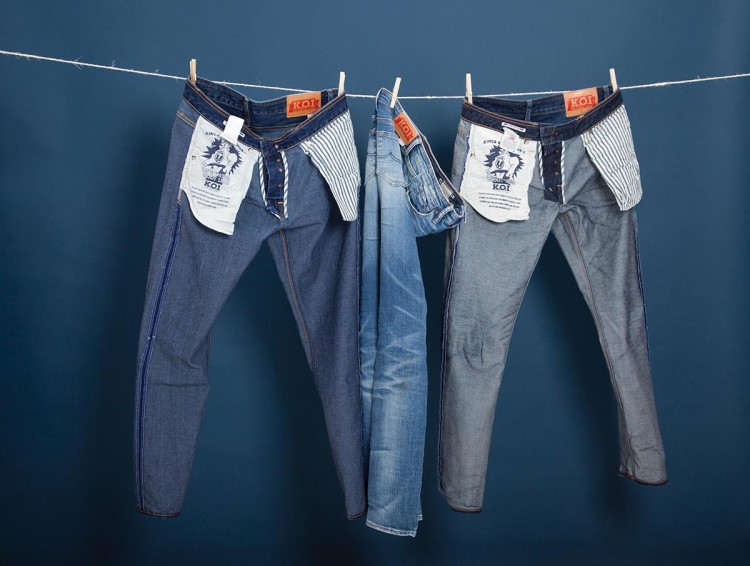 The easiest way to 'dehydrate' jeans after washing is to drain the water 