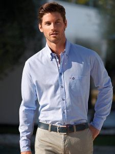 Man in a blue shirt with a button collar 