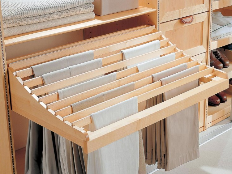 A special compartment for trousers is additionally attached under the shelf in the closet and optimizes space 