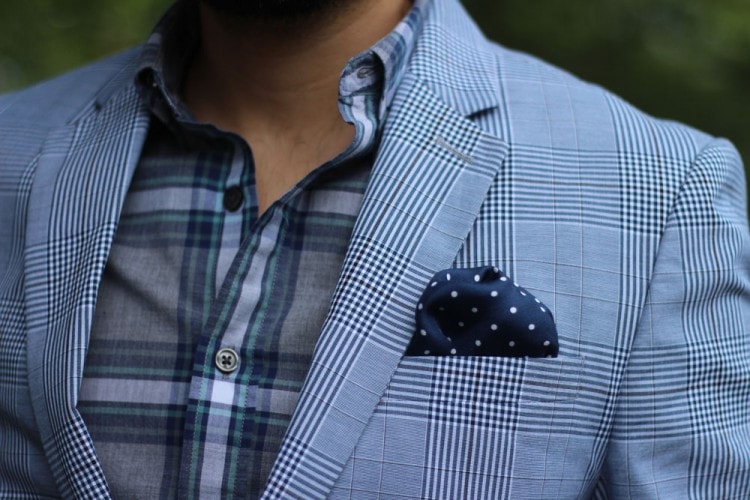 Check blazer and shirt paired with polka dot pocket squares 