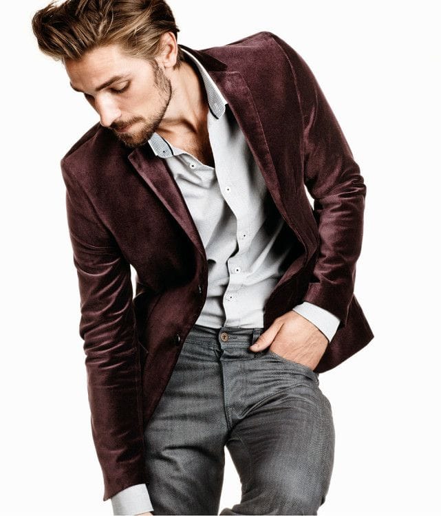 A corduroy blazer complete with a discreet shirt and gray jeans will make your New Year's party outfit truly festive 