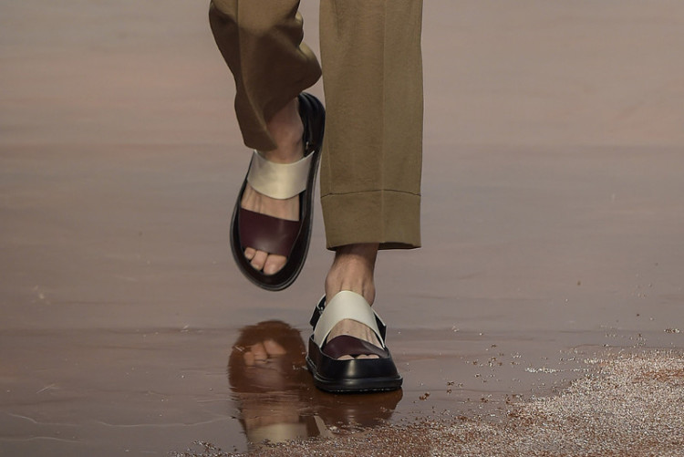 Each season, designers come up with new versions of men's sandals (pictured: Marni spring-summer 2017 show) 