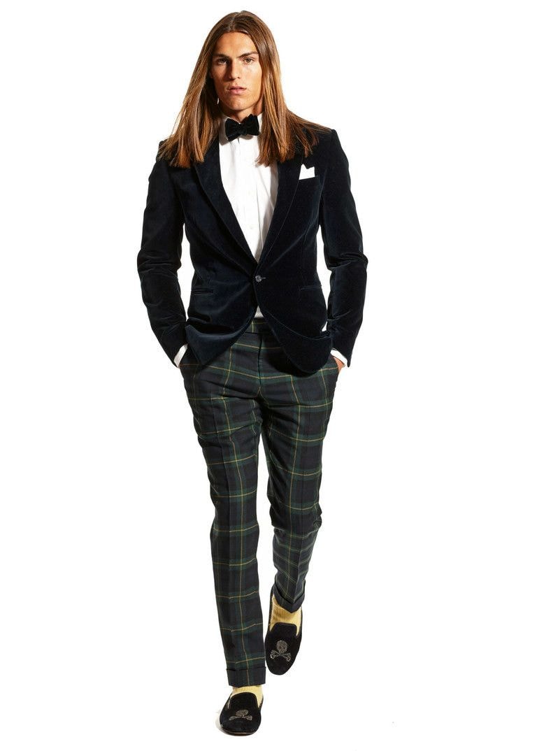 An interesting casual solution featuring a discreet corduroy jacket, plaid trousers, matched to the color of bright socks and loafers 