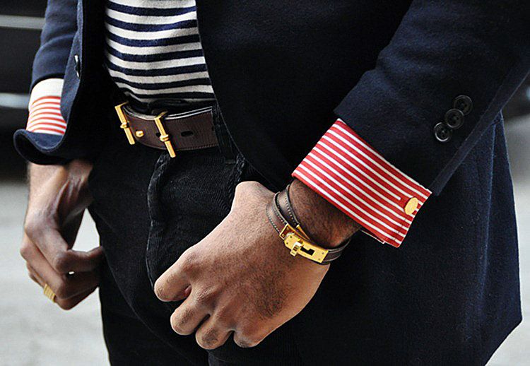 Creative men's bracelet made of leather and gold echoes the belt on the trousers in design and color 
