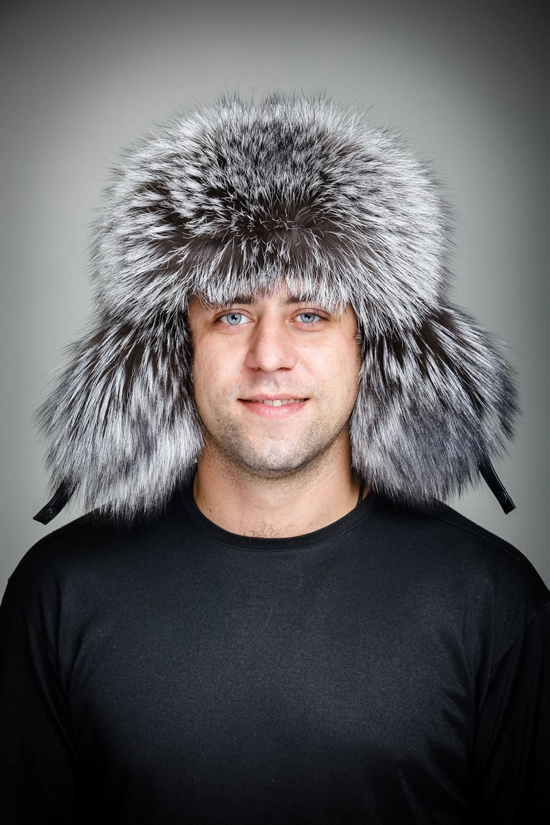 A man in a fur hat with earflaps 
