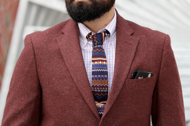 Burgundy blazer combined with a plaid shirt and tie of different prints 