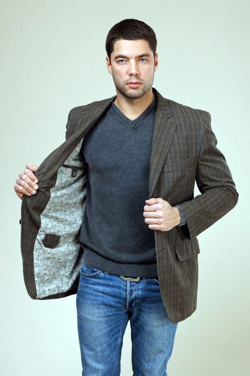 Tweed jacket and jumper go well with denim trousers 
