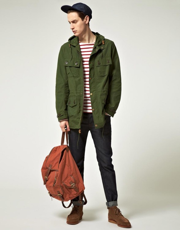 Street style youthful look - traditional green parka, jeans, striped long sleeve 
