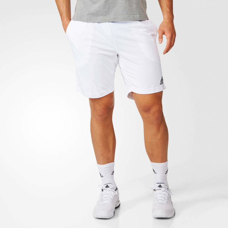 For a sporty look, white sneakers are a reasonable and versatile choice. 